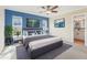 Primary bedroom with staged furniture and ensuite bath at 13214 Moran Dr, Tampa, FL 33618