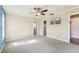 Spacious bedroom with ceiling fan and ensuite bath at 13214 Moran Dr, Tampa, FL 33618