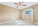 Bedroom with ceiling fan and neutral colored walls at 13214 Moran Dr, Tampa, FL 33618
