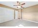 Spacious bedroom with ceiling fan and large closet at 13214 Moran Dr, Tampa, FL 33618