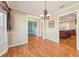 Dining area with hardwood floors, view to living and kitchen areas at 13214 Moran Dr, Tampa, FL 33618
