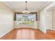 Bright dining room features a bay window and hardwood floors at 13214 Moran Dr, Tampa, FL 33618