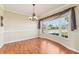 Dining room with hardwood floors, bay window, and chandelier at 13214 Moran Dr, Tampa, FL 33618