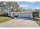 House exterior showcasing a gray garage door and driveway at 13214 Moran Dr, Tampa, FL 33618