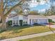 Charming house with a red door and grey exterior at 13214 Moran Dr, Tampa, FL 33618