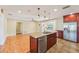 Open concept kitchen with island and hardwood floors at 13214 Moran Dr, Tampa, FL 33618