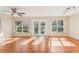 Sunroom with hardwood floors and French doors at 13214 Moran Dr, Tampa, FL 33618