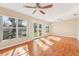 Bright sunroom with hardwood floors and multiple windows at 13214 Moran Dr, Tampa, FL 33618