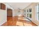 Sunroom with hardwood floors and access to backyard at 13214 Moran Dr, Tampa, FL 33618
