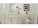 Clean bathroom with white vanity, toilet, and shower at 15233 Rainbow Quartz St, Wimauma, FL 33598