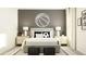 Spacious bedroom with a neutral color palette and sports theme decor at 15233 Rainbow Quartz St, Wimauma, FL 33598