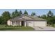 Attractive one-story house with a two-car garage and well-manicured lawn at 15233 Rainbow Quartz St, Wimauma, FL 33598