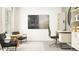 Bright home office features built-in shelving and a workspace with seating area at 15233 Rainbow Quartz St, Wimauma, FL 33598