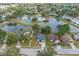 Community overview showing homes, lake, and recreational areas at 1628 Baker Rd, Lutz, FL 33559