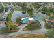 Community overview with pool, tennis court, and lake at 1628 Baker Rd, Lutz, FL 33559