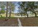 Stone path leading to a pond in the backyard at 1628 Baker Rd, Lutz, FL 33559