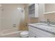Bathroom with granite countertop vanity and shower/tub combo at 1628 Baker Rd, Lutz, FL 33559