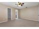 Bedroom with ceiling fan and carpet flooring at 1628 Baker Rd, Lutz, FL 33559