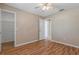 Bedroom with laminate wood floors and a walk-in closet at 1628 Baker Rd, Lutz, FL 33559