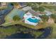 Community pool and recreational area near lake at 1628 Baker Rd, Lutz, FL 33559