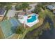 Aerial view of community pool, tennis, and basketball courts at 1628 Baker Rd, Lutz, FL 33559