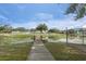 Wooden footbridge over a calm lake at 1628 Baker Rd, Lutz, FL 33559