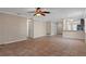 Open living room with tile floors and kitchen views at 1628 Baker Rd, Lutz, FL 33559