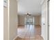 Spacious living room with tile floors and access to backyard at 1628 Baker Rd, Lutz, FL 33559
