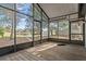 Screened porch overlooking a pond and backyard at 1628 Baker Rd, Lutz, FL 33559