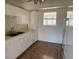Efficient kitchen featuring ample cabinetry and a double sink at 21480 Olean Blvd, Port Charlotte, FL 33952