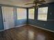 Living room with light blue walls, laminate floors and multiple windows at 21480 Olean Blvd, Port Charlotte, FL 33952