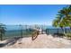 Private dock with waterfront access and stunning bay views, perfect for boaters and water enthusiasts at 26 Sunset Bay Drive, Belleair, FL 33756