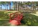 Relaxing community park with wooden footbridge and picnic tables at 2700 Bayshore Blvd # 11302, Dunedin, FL 34698