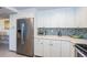 Modern kitchen with stainless steel appliances and white shaker cabinets at 2700 Bayshore Blvd # 11302, Dunedin, FL 34698