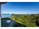 Stunning water view from private balcony, showcasing waterfront and lush landscape at 2700 Bayshore Blvd # 11302, Dunedin, FL 34698