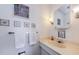 Clean bathroom with vanity, sink, and tiled walls at 2700 Bayshore Blvd # 4309, Dunedin, FL 34698
