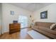 Charming bedroom with sofa, dresser, and large window at 2700 Bayshore Blvd # 4309, Dunedin, FL 34698