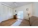 Functional bedroom with sofa, dresser, and closet at 2700 Bayshore Blvd # 4309, Dunedin, FL 34698