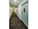Condo hallway with carpeted floors and doors to units at 2700 Bayshore Blvd # 4309, Dunedin, FL 34698