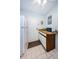 Kitchen area with white cabinets, refrigerator, and microwave at 2700 Bayshore Blvd # 4309, Dunedin, FL 34698