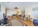 Bright living room with wood floors, comfy seating, and a ceiling fan at 2700 Bayshore Blvd # 4309, Dunedin, FL 34698