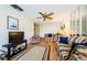 Living room featuring wood floors, two sofas, and a ceiling fan at 2700 Bayshore Blvd # 4309, Dunedin, FL 34698