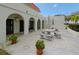 Relaxing outdoor patio with seating and shade umbrella at 2700 Bayshore Blvd # 4309, Dunedin, FL 34698