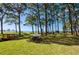 Scenic picnic area with tables under the trees at 2700 Bayshore Blvd # 4309, Dunedin, FL 34698