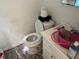 Bathroom featuring standard toilet and sink fixtures; in need of updating at 3416 N 48Th St, Tampa, FL 33605
