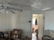 Spacious bedroom with a ceiling fan and closet, offering potential for renovation at 3416 N 48Th St, Tampa, FL 33605