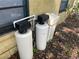Exterior view of a water softener unit with plumbing at 3416 N 48Th St, Tampa, FL 33605