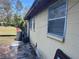 Side view of a cozy house, with AC unit and other items at 3416 N 48Th St, Tampa, FL 33605