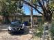 Quaint single-story home with mature trees, offering ample shade in the front yard at 3416 N 48Th St, Tampa, FL 33605