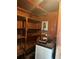 Small storage room with shelving units and breaker box at 3416 N 48Th St, Tampa, FL 33605